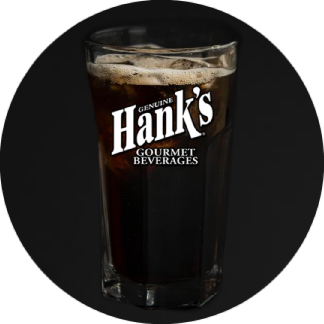 A glass of hank 's root beer is shown.