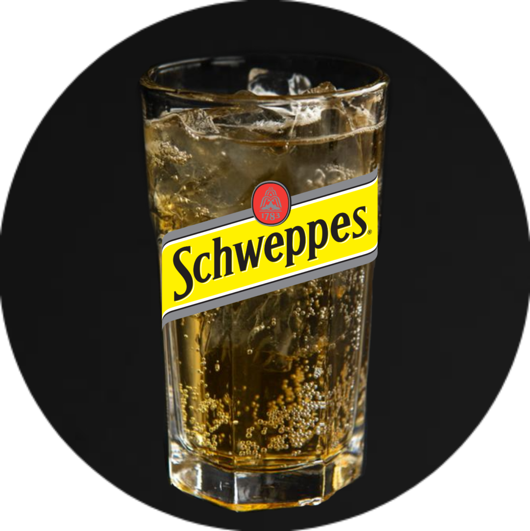 A glass of beer with the name schweppes on it.