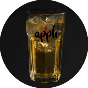 A glass of apple juice with ice in it.