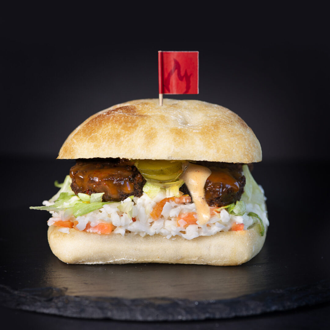 A meatball sandwich with coleslaw and cole slaw.